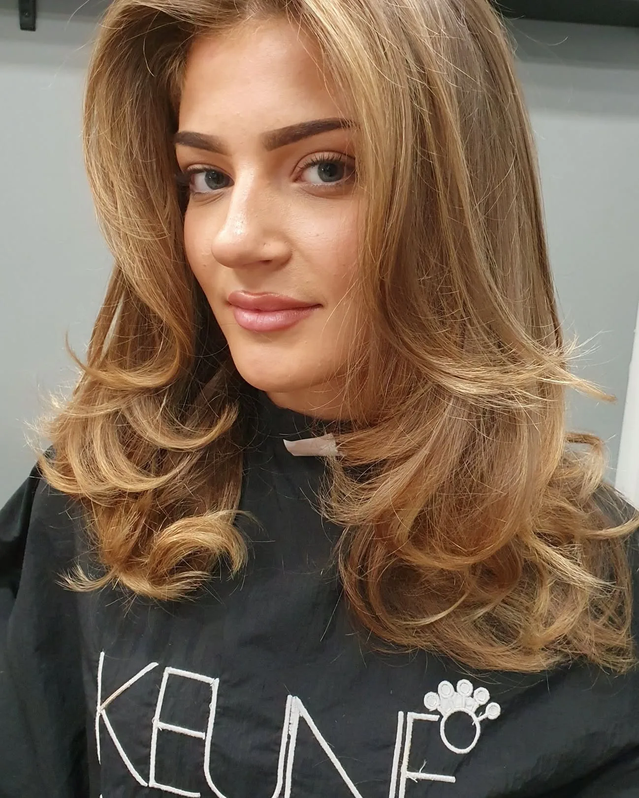 Honey-blonde voluminous blow-wave, Keune cape